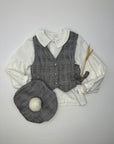 Vest features black buttons